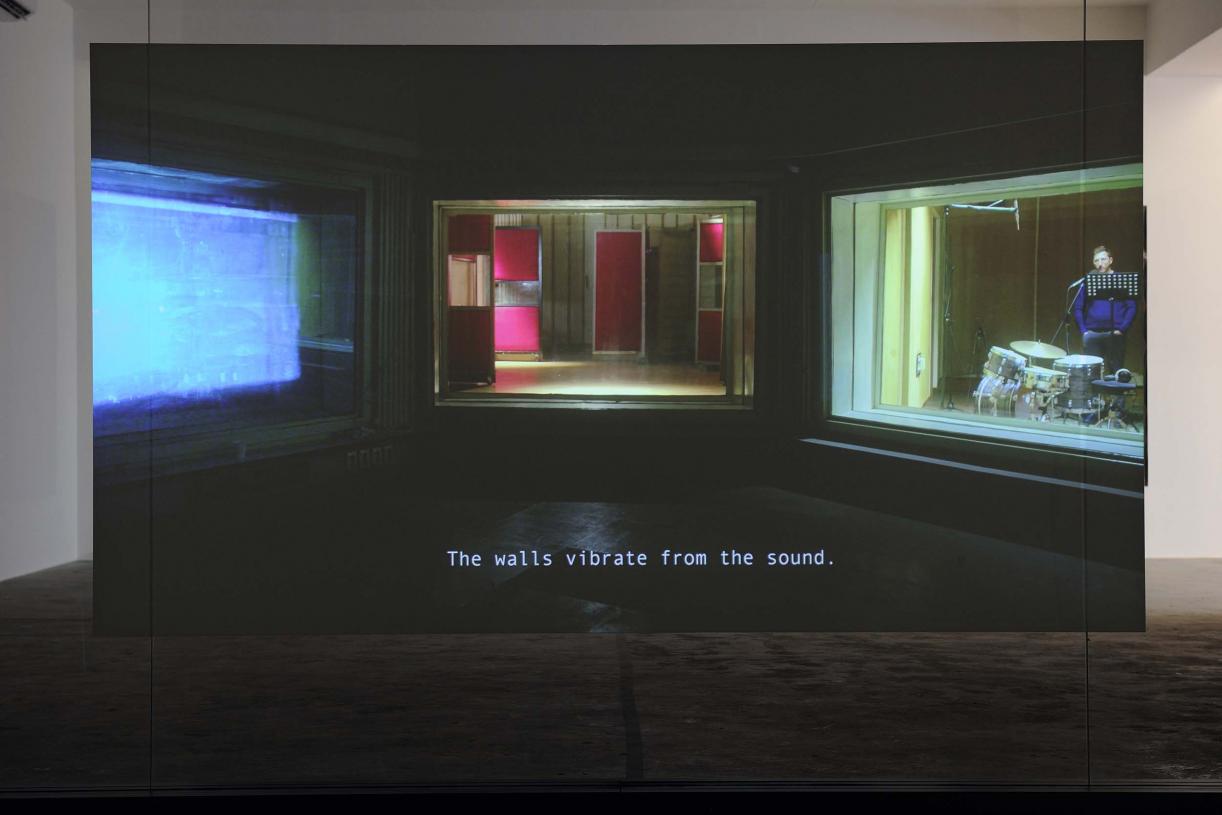 Walled Unwalled, 2018, Single-channel video, color, sound, Installation, with metal structure, glass & foil, 20 mins, Ed. 6 + 2 AP, Wall design in collaboration with Müller Aprahamian