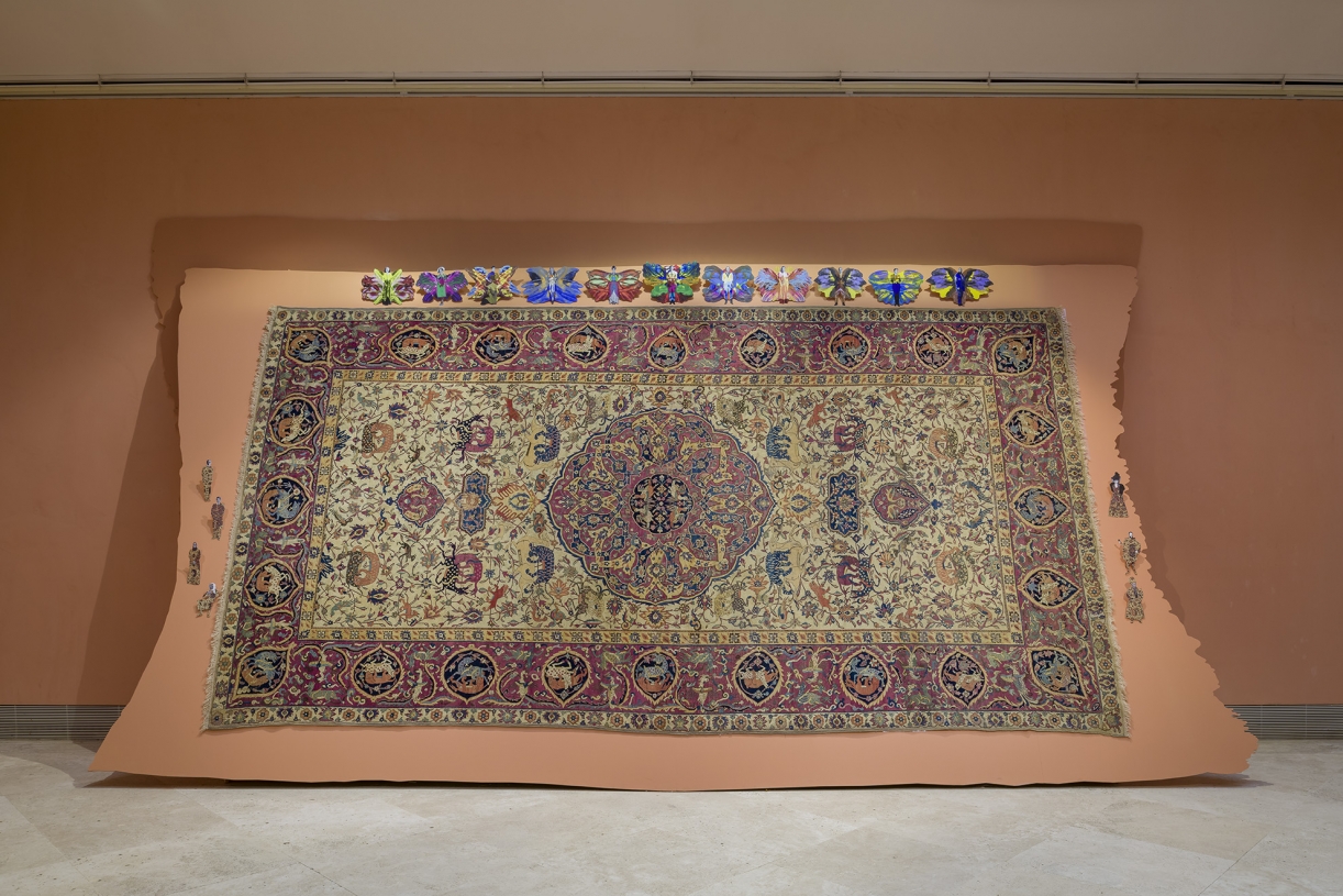 Walid Raad, Frontispiece II: The Carpet, 2021, Installation with carpet, pigmented inkjet prints, wood, 279 x 510 cm, Installation view Museo Nacional Thyssen-Bornemisza, Madrid, 2021. Carpet: Courtesy of the Thyssen-Bornemisza Collections