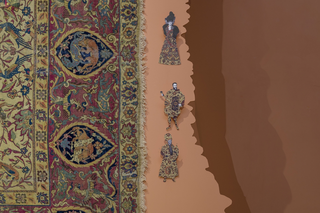 Walid Raad, Frontispiece II: The Carpet, 2021, Installation with carpet, pigmented inkjet prints, wood, 279 x 510 cm, Installation view Museo Nacional Thyssen-Bornemisza, Madrid, 2021. Carpet: Courtesy of the Thyssen-Bornemisza Collections