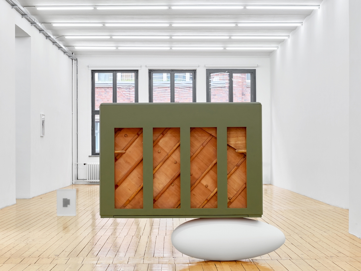The Relief (Steinway Victory Vertical, 1944), 2025, Steinway Victory Vertical, 1944, piano crate, fiberglass, resin, paint , Piano: 144,5 × 167 × 49 cm, Crate: 121 × 161 × 76 cm, Unique