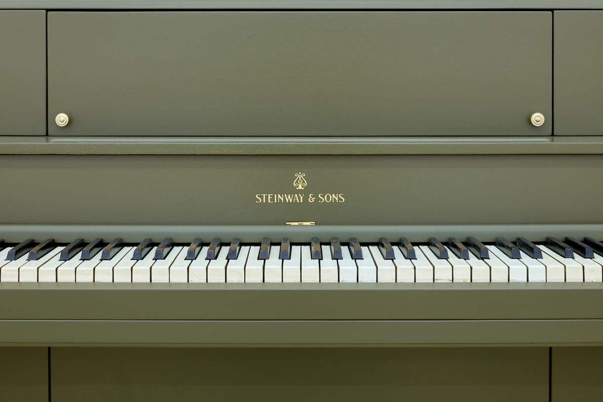 The Relief (Steinway Victory Vertical, 1944), 2025, Steinway Victory Vertical, 1944, piano crate, fiberglass, resin, paint , Piano: 144,5 × 167 × 49 cm, Crate: 121 × 161 × 76 cm, Unique