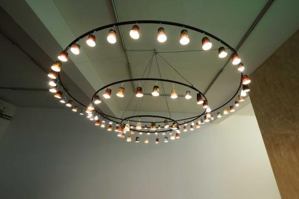 Al Nathafa Min Al Iman, 2019, Metal, wire, paper, plastic cups, & light bulbs, Diameters 3 m, 2 m, 1 m