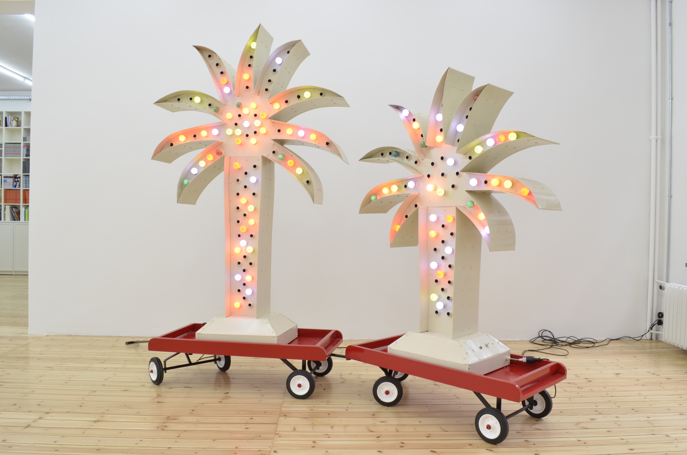 Twin Palm Island, 2012, Steel, galvanized sheet metal, colored electric bulbs, plastic and rubber wheels, 319 x 160 x 35 cm, Edition 3 + 1 AP