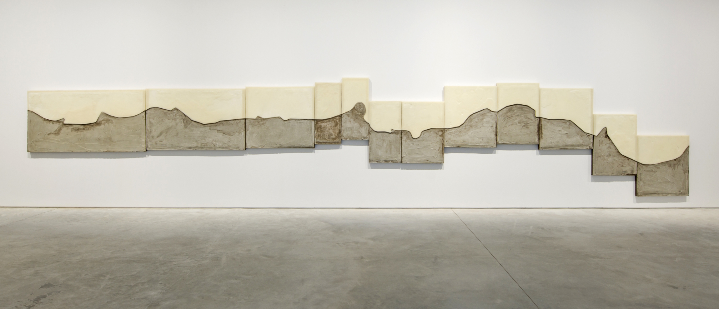 Marwan Rechmaoui, Untitled 12, 2017. Concrete, brass, beeswax, fibre mesh, Styrofoam on wood board, 200 x 1000 cm, Unique. Installation view, Sharjah Biennial 13, 2017. Commissioned by Sharjah Art Foundation. Image courtesy of Sharjah Art Foundation