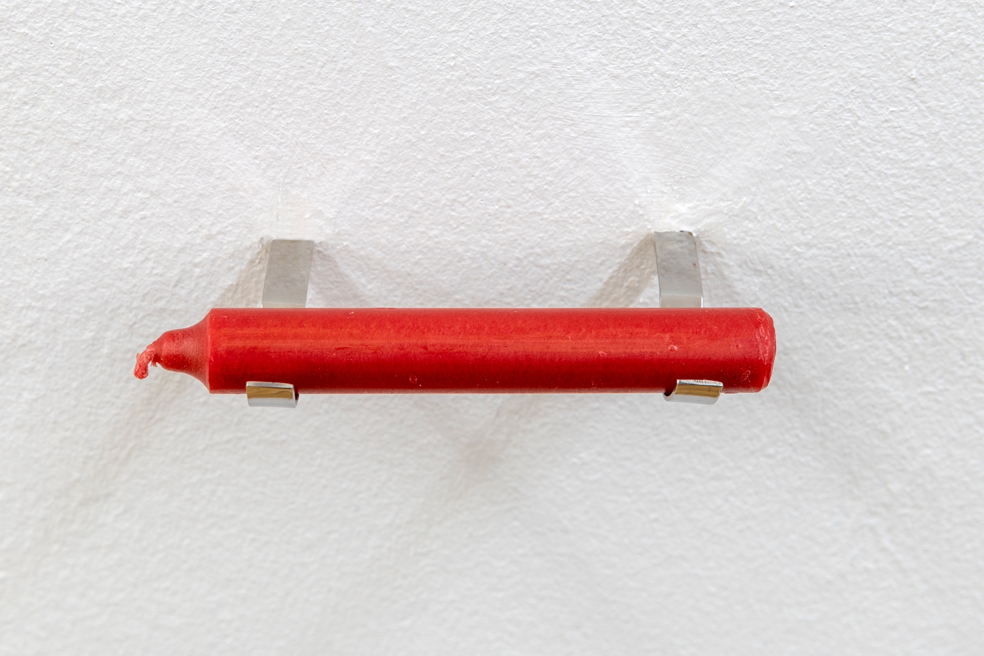 Sung Tieu, An Old Flame, 2022, Candle from VEB Wittol Wittenberg, metal fixing 10,5 cm (length), 1 cm diameter, Unique