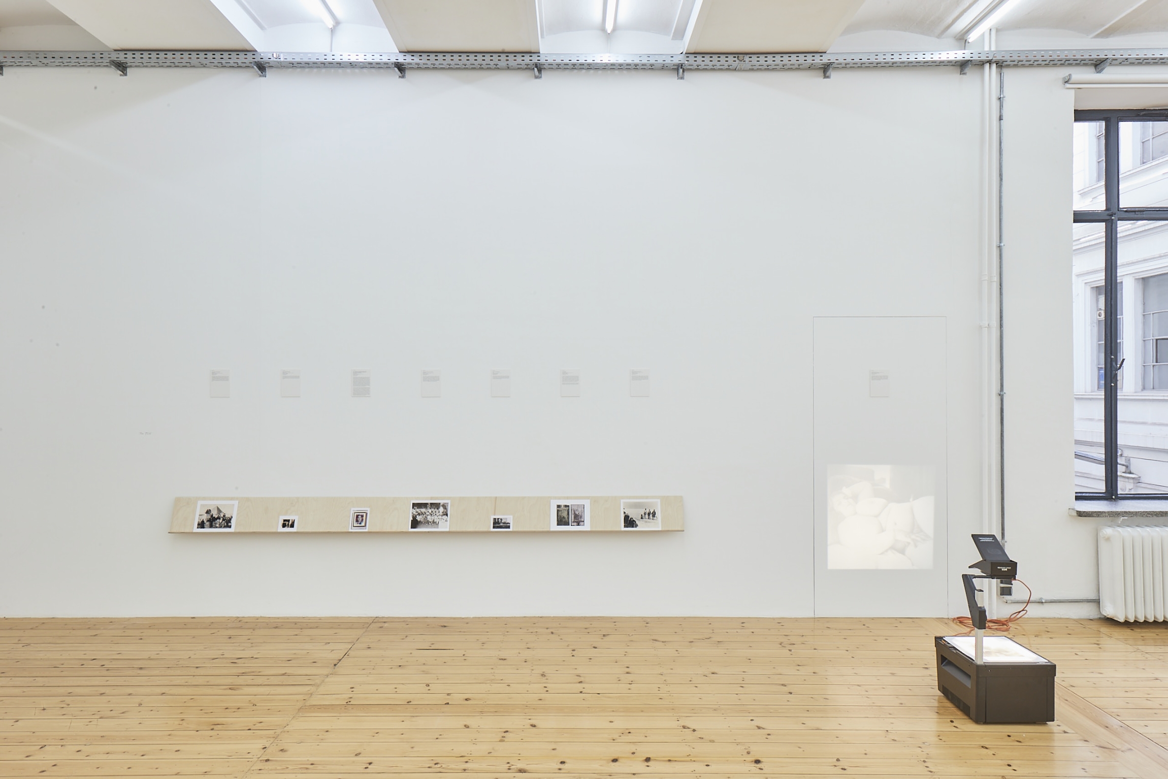 Akram Zaatari, The Fold, 2022, Installation with 9 photographs and relief, Various dimensions