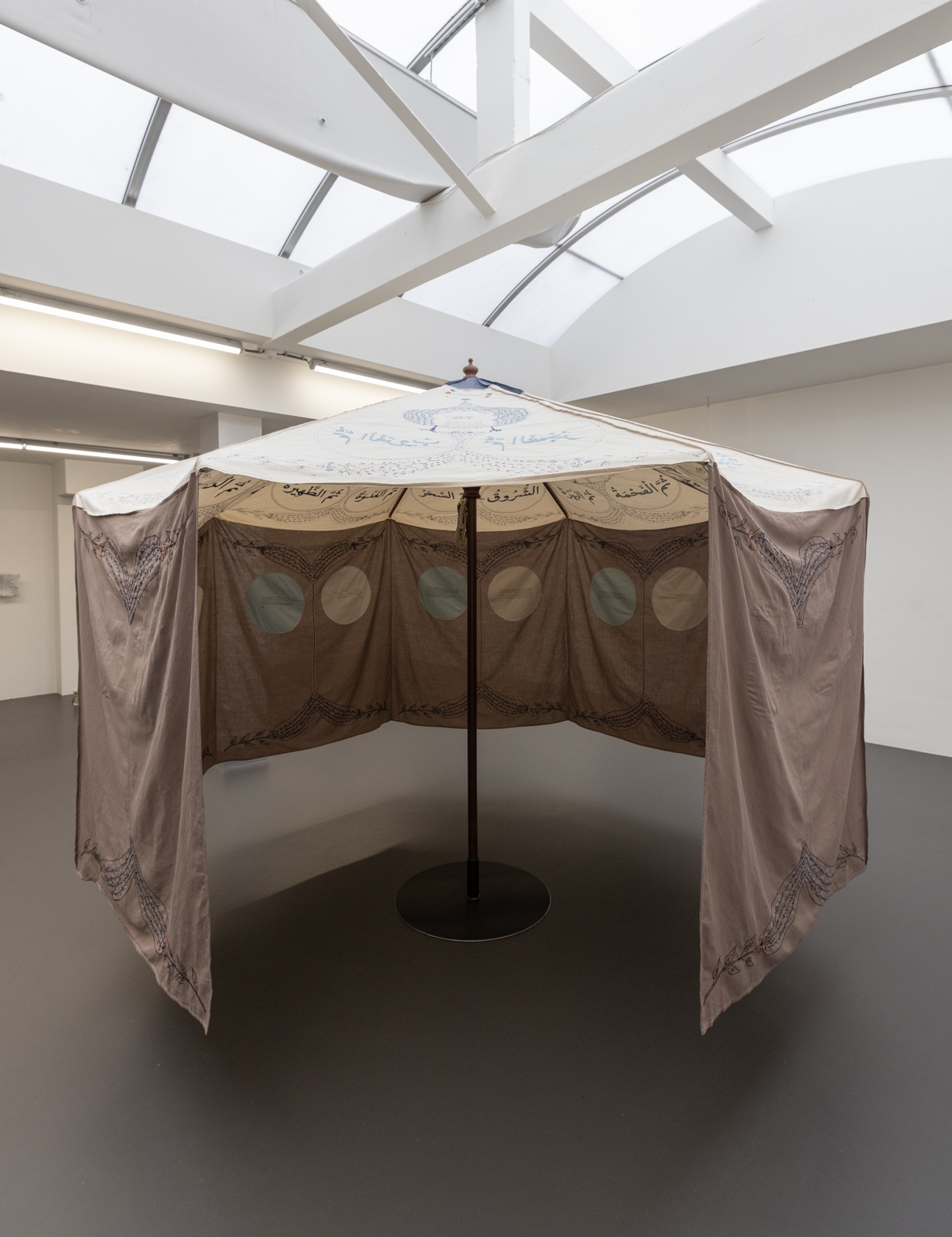 Mounira Al Solh, Lackadaisical Sunset to Sunset, 2022, Installation: embroidered textile, wood, metal, mixed media on paper, sound; Dimensions variable