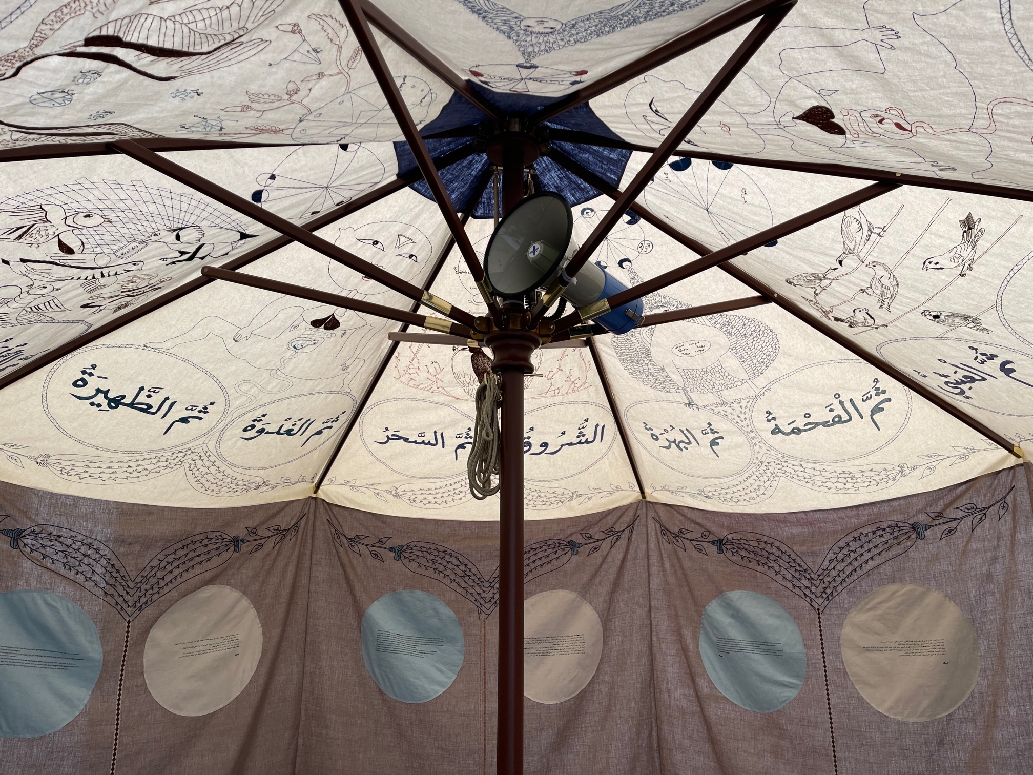 Mounira Al Solh, Lackadaisical Sunset to Sunset, 2022, Installation: embroidered textile, wood, metal, mixed media on paper, sound; Dimensions variable
