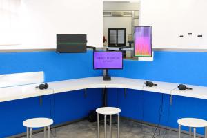 The Whole Truth, 2012, Reverse engineered lie detector, 3 channel video, stereo sound, desk, 3 chairs, 3 artificial plants, 24 minutes, 612 x 435 x 190 cm, Ed.5 + 2 AP