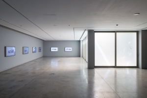 Shot Twice (With the Same Bullet), 2021. 8-channel video with colour and sound; 9 minutes, 8 light-boxes, digital prints on acrylic: 125 x 73 x 8.5 cm each. Installation view: The Sonic Image, Sharjah Art Foundation, 2022. Commissioned by Portikus, Frankfurt. 