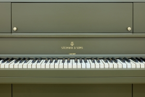 The Relief (Steinway Victory Vertical, 1944), 2025, Steinway Victory Vertical, 1944, piano crate, fiberglass, resin, paint , Piano: 144,5 × 167 × 49 cm, Crate: 121 × 161 × 76 cm, Unique