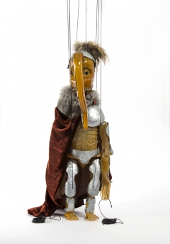 Cabaret Crusades: The Secrets of Karbalaa, Marionette (Orange soldier), 2014, Glass, fabric, enamel, thread, 51 x 16 x 13 cm